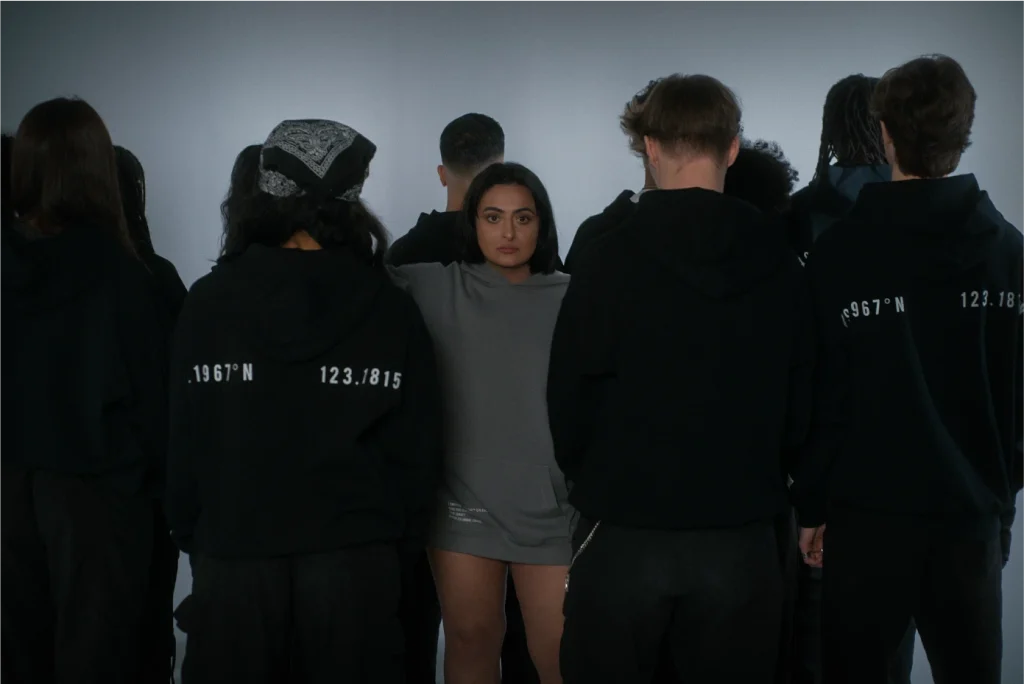 Founder Ashveen Gill surrounded by models wearing her streetwear brand.