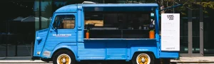 A blue food truck opens for business.